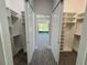 Large walk-in closet with ample shelving and hanging space at 547 Sanctuary Golf Pl, Apopka, FL 32712