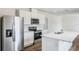 Modern kitchen with white cabinets, stainless steel appliances, and a large island at 5542 Hayloft Dr, Apopka, FL 32712