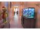 Hallway with a view of the living area and a fish tank at 624 Autumn Stream Dr, Auburndale, FL 33823