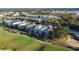 Aerial view of houses on a golf course at 7405 Excitement Dr, Kissimmee, FL 34747