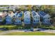 Aerial view showing houses near a golf course at 7405 Excitement Dr, Kissimmee, FL 34747