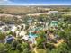 Resort-style pool with multiple pools, palm trees, and lounge areas at 7405 Excitement Dr, Kissimmee, FL 34747