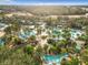 Expansive resort pool area with winding waterways and lush landscaping at 7405 Excitement Dr, Kissimmee, FL 34747