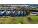 Aerial view showcasing homes near a golf course at 7405 Excitement Dr, Kissimmee, FL 34747
