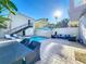 Private backyard oasis with a refreshing pool, patio furniture, and ample space for entertaining at 7405 Excitement Dr, Kissimmee, FL 34747