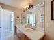 Elegant bathroom with a double vanity and large mirror at 7405 Excitement Dr, Kissimmee, FL 34747