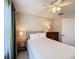Cozy bedroom with a comfortable bed, ceiling fan, and ample natural light at 7405 Excitement Dr, Kissimmee, FL 34747