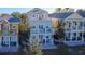 Aerial view of three story house among similar houses at 7405 Excitement Dr, Kissimmee, FL 34747