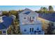 Aerial view of a three-story house with a rooftop deck at 7405 Excitement Dr, Kissimmee, FL 34747