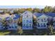 Aerial view of row of three story houses at 7405 Excitement Dr, Kissimmee, FL 34747