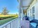 Spacious porch with comfortable seating and golf course view at 7405 Excitement Dr, Kissimmee, FL 34747