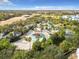 Community waterpark with slides, a sandy beach, and lounge chairs at 7405 Excitement Dr, Kissimmee, FL 34747