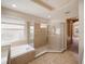 Spa-like Primary bathroom with walk-in shower and soaking tub at 8320 Via Bella Notte, Orlando, FL 32836