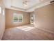 Main bedroom with carpet flooring, ceiling fan and sliding doors at 8320 Via Bella Notte, Orlando, FL 32836