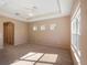 Spacious bedroom with carpet flooring and multiple windows at 8320 Via Bella Notte, Orlando, FL 32836