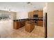 Eat-in kitchen with wood cabinets and granite countertops at 8320 Via Bella Notte, Orlando, FL 32836