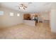 Spacious living area with tile flooring and kitchen views at 8320 Via Bella Notte, Orlando, FL 32836