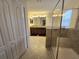 Large bathroom with double vanity and shower at 9037 Shadow Mountain St, Davenport, FL 33896
