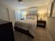 Comfortable bedroom with a double bed and nightstand at 9037 Shadow Mountain St, Davenport, FL 33896
