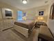 Bright bedroom with a queen bed and dresser at 9037 Shadow Mountain St, Davenport, FL 33896
