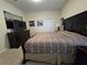 Spacious bedroom with king-size bed and ample closet space at 9037 Shadow Mountain St, Davenport, FL 33896
