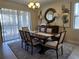 Elegant dining room featuring a large table and access to the backyard at 9037 Shadow Mountain St, Davenport, FL 33896