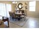 Bright dining area with a wood table and neutral decor at 9037 Shadow Mountain St, Davenport, FL 33896
