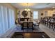 Elegant dining room with a large table and access to the backyard at 9037 Shadow Mountain St, Davenport, FL 33896