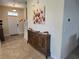 Bright and airy entryway with decorative console table at 9037 Shadow Mountain St, Davenport, FL 33896