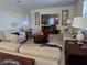 Spacious living room with ample seating and a large flat-screen TV at 9037 Shadow Mountain St, Davenport, FL 33896