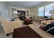 Spacious living room featuring neutral tones and comfortable furniture at 9037 Shadow Mountain St, Davenport, FL 33896