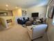 Spacious loft area furnished with seating and a TV at 9037 Shadow Mountain St, Davenport, FL 33896