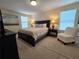 Spacious main bedroom with a king-size bed at 9037 Shadow Mountain St, Davenport, FL 33896