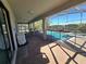 Covered patio with pool access and outdoor kitchen at 9037 Shadow Mountain St, Davenport, FL 33896