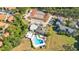 Aerial view showing tennis courts and community pool at 126 Scottsdale Sq # 126, Winter Park, FL 32792