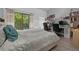 Bedroom with a bed, workspace, and access to a balcony at 126 Scottsdale Sq # 126, Winter Park, FL 32792