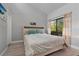 Bright bedroom with a comfortable bed and plenty of natural light at 126 Scottsdale Sq # 126, Winter Park, FL 32792