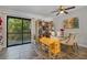Dining area with glass-top table and access to a patio at 126 Scottsdale Sq # 126, Winter Park, FL 32792