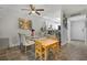 Bright dining area with glass table and four beige chairs at 126 Scottsdale Sq # 126, Winter Park, FL 32792