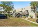 Exterior view of condo building, showcasing its architecture and landscaping at 126 Scottsdale Sq # 126, Winter Park, FL 32792