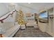 Living room with two sofas, a Christmas tree, and built-in shelving at 126 Scottsdale Sq # 126, Winter Park, FL 32792
