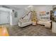 Living room with two sofas, a Christmas tree, and a large TV at 126 Scottsdale Sq # 126, Winter Park, FL 32792