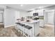 Modern kitchen with white shaker cabinets, quartz countertops, and stainless steel appliances at 134 Lake Harriet Dr, Altamonte Springs, FL 32714