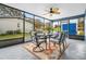 Relaxing screened porch with outdoor dining set at 134 Lake Harriet Dr, Altamonte Springs, FL 32714