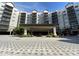 Building exterior with a grand entrance and landscaping at 14501 Grove Resort Ave # 2716, Winter Garden, FL 34787