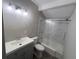 Updated bathroom with gray vanity and marble shower at 2205 12Th Nw St, Winter Haven, FL 33881