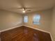 Spacious bedroom with hardwood floors and window blinds at 2205 12Th Nw St, Winter Haven, FL 33881