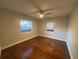 Bright bedroom with hardwood floors and window coverings at 2205 12Th Nw St, Winter Haven, FL 33881