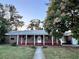Front view of charming brick house with porch at 2205 12Th Nw St, Winter Haven, FL 33881