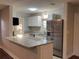 Modern kitchen with granite countertops and stainless steel appliances at 2205 12Th Nw St, Winter Haven, FL 33881